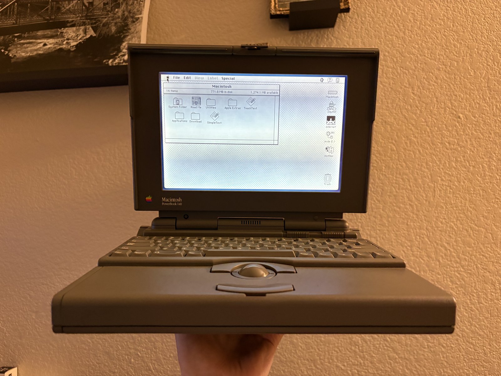 The PowerBook 140 with its screen running.